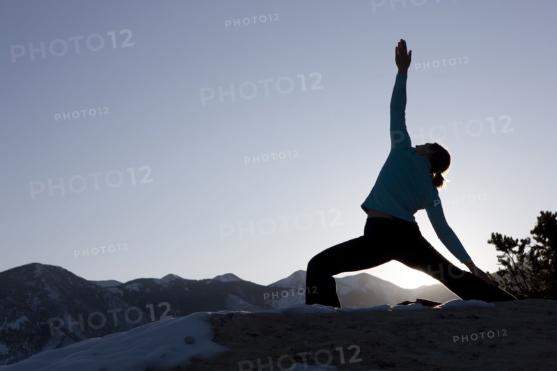 Woman doing yoga outdoors. Photographer: Dan Bannister