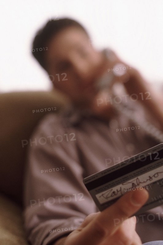 Man making credit card purchase. Photographer: Rob Lewine