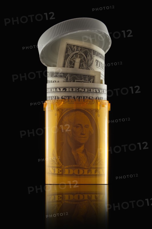 Money in prescription bottle. Photographer: Mike Kemp