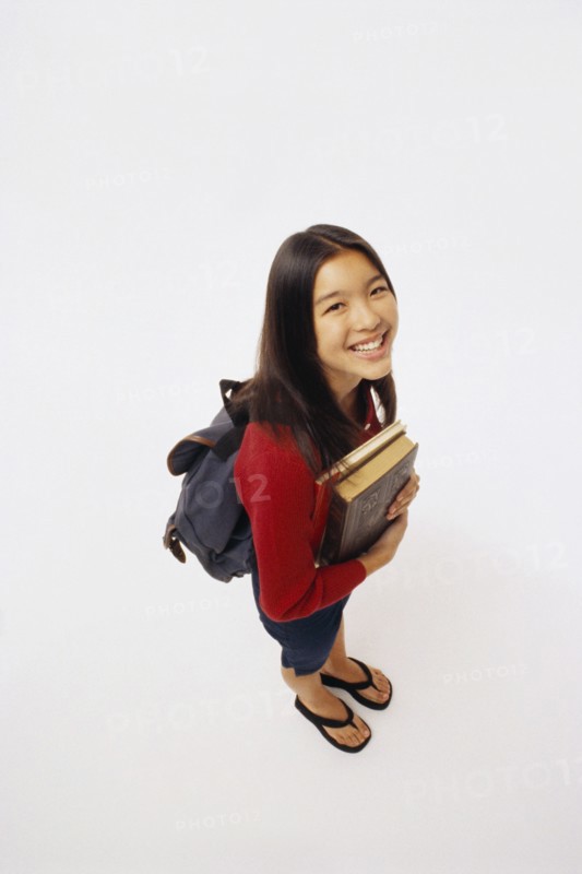 Student holding books. Photographer: Rob Lewine