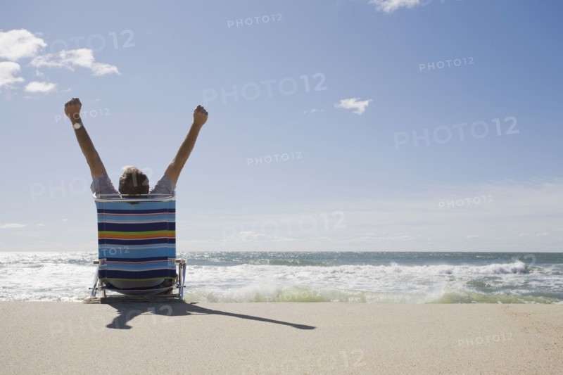 Relaxing on the beach. Photographer: Chris Hackett
