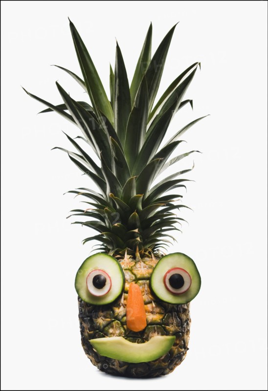 Pineapple with a happy face. Photographer: Mike Kemp