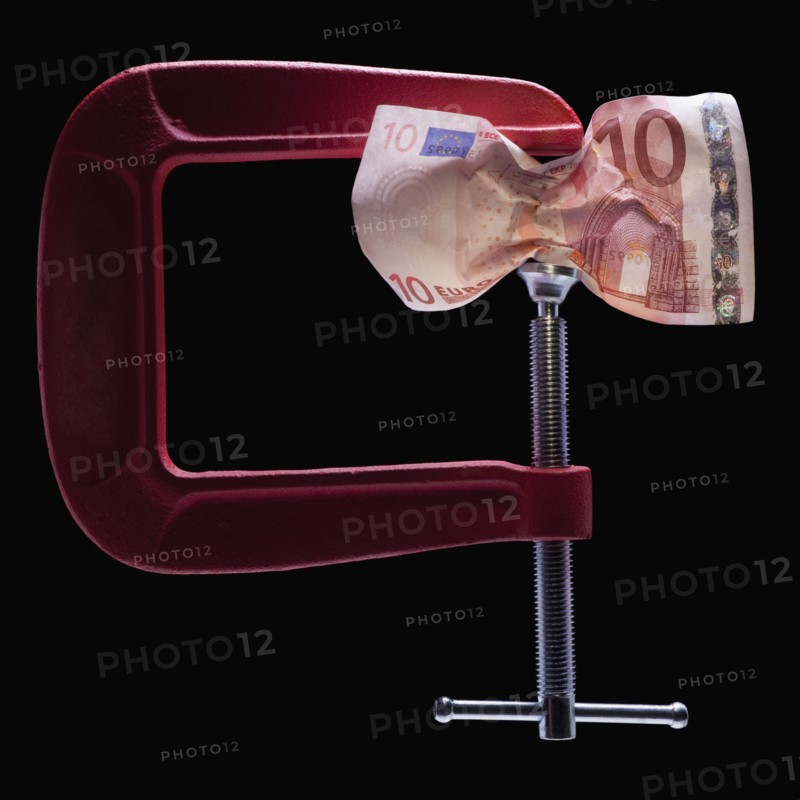 Money in a clamp. Photographer: Mike Kemp