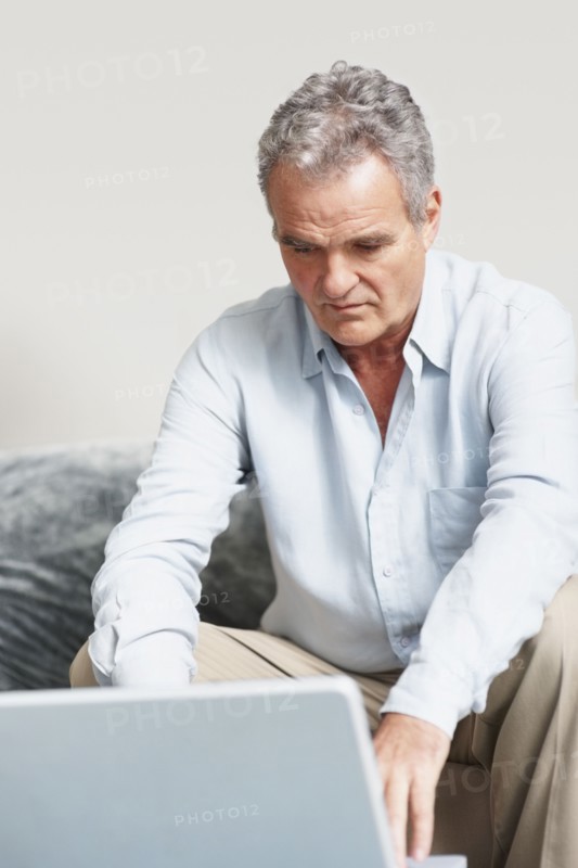 Man working on laptop. Photographer: momentimages