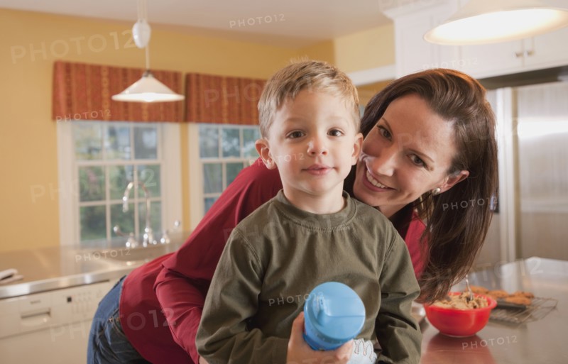 Mother and son in kitchen. Photographer: mark edward atkinson