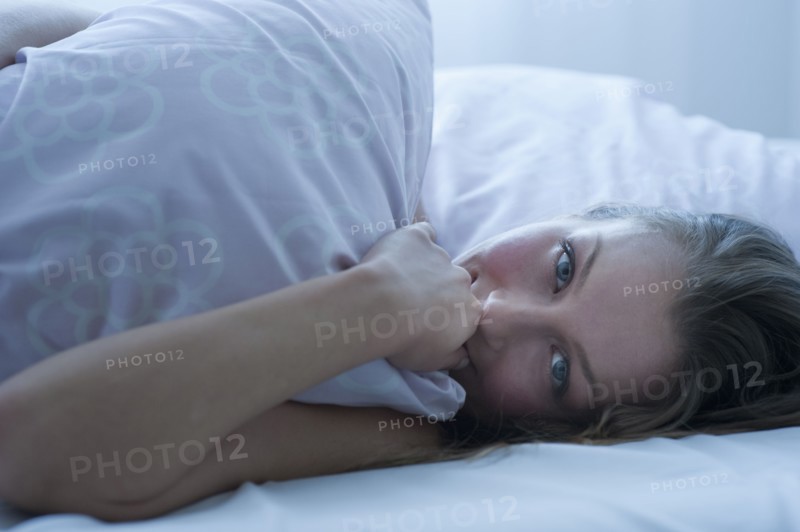 Woman in bed.
