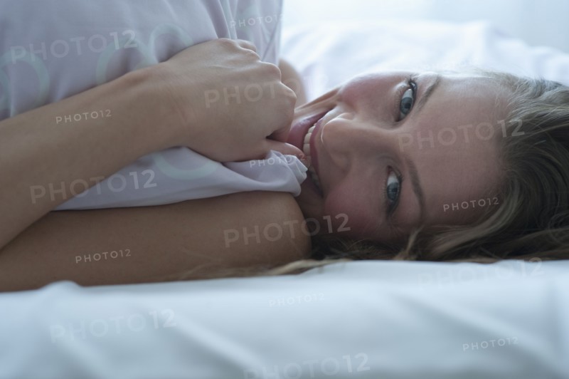 Woman in bed.
