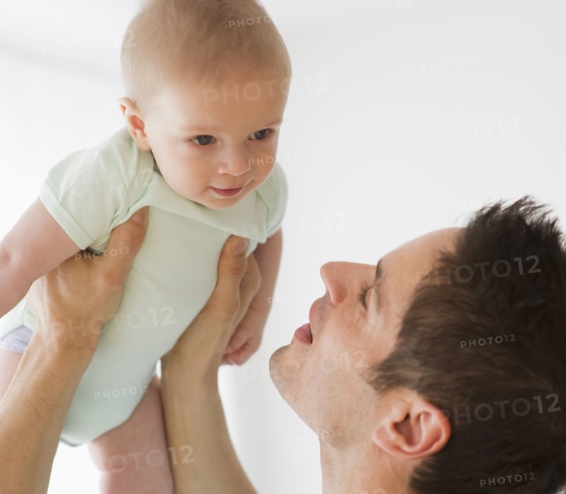 Father holding baby.