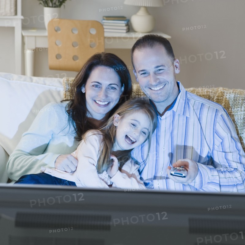 Family watching television. Photographer: Jamie Grill