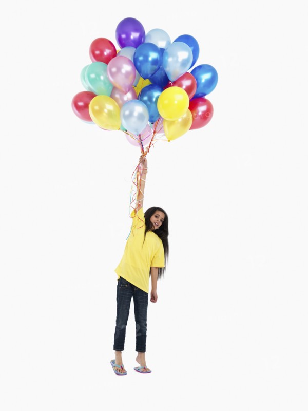 Girl holding balloons. Photographer: momentimages
