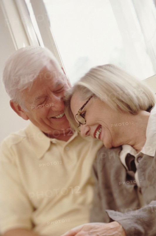 Elderly couple embracing. Photographer: Rob Lewine