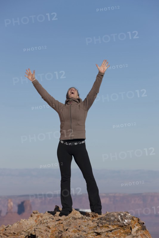 Woman at top of canyon. Photographer: Dan Bannister