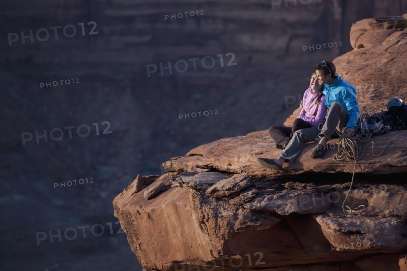 Hikers at top of cliff. Photographer: Dan Bannister