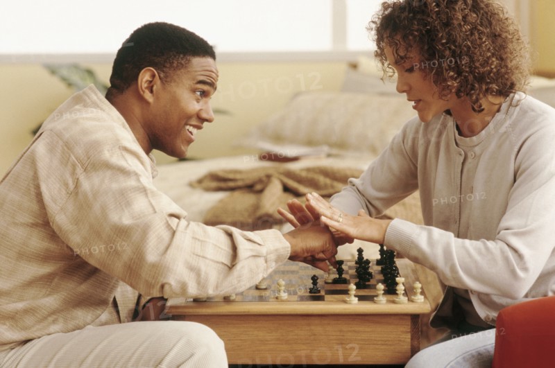 Couple playing chess. Photographer: Rob Lewine