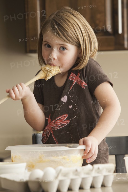 Tasting the batter. Photographer: Mike Kemp