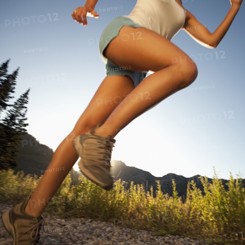 Jogger on rural trail. Photographer: Mike Kemp