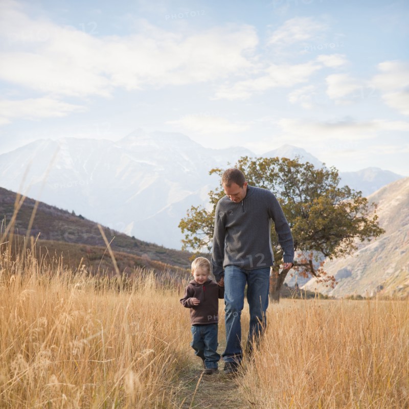 Father and son walking outdoors. Photographer: Mike Kemp