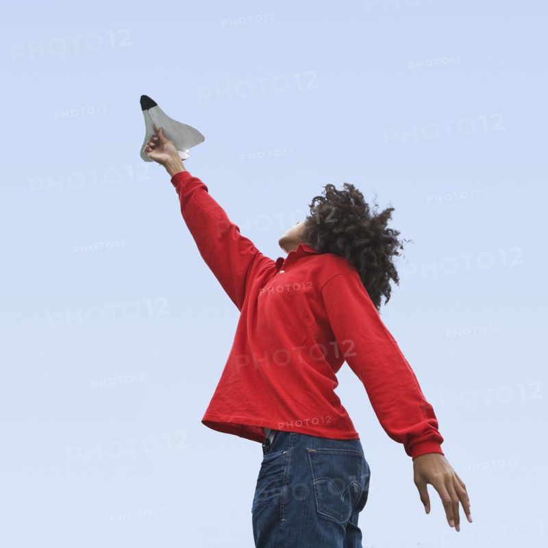 Woman flying toy plane. Photographer: Pauline St.Denis