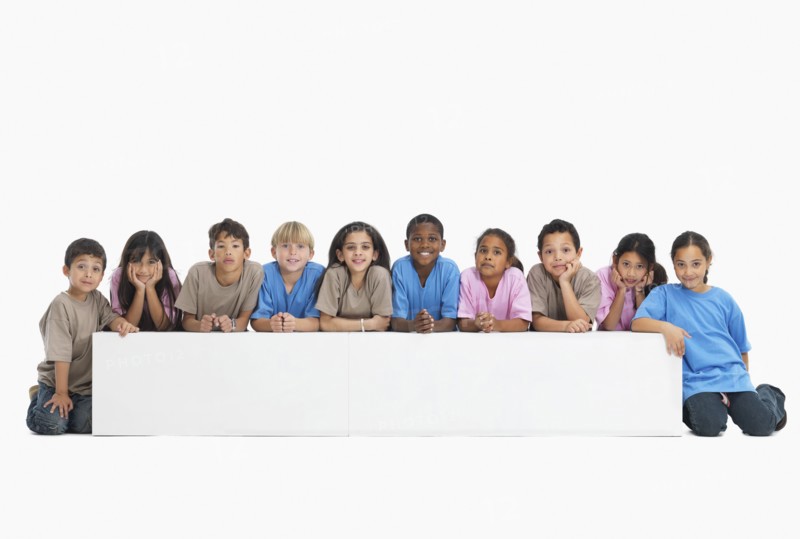 Children sitting in a row. Photographer: momentimages