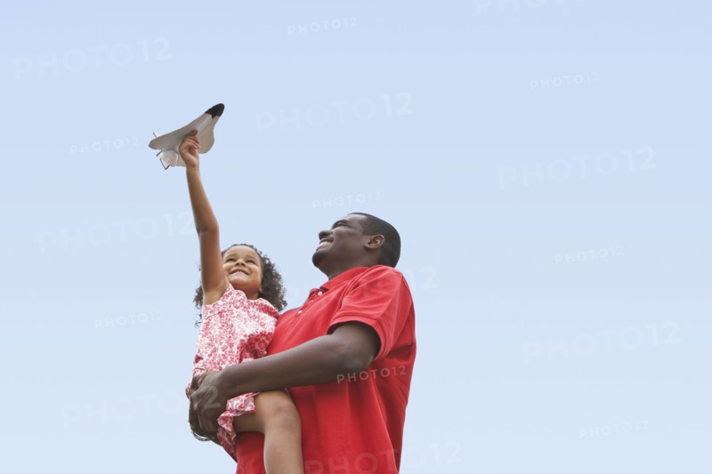 Child playing with toy plane. Photographer: Pauline St.Denis