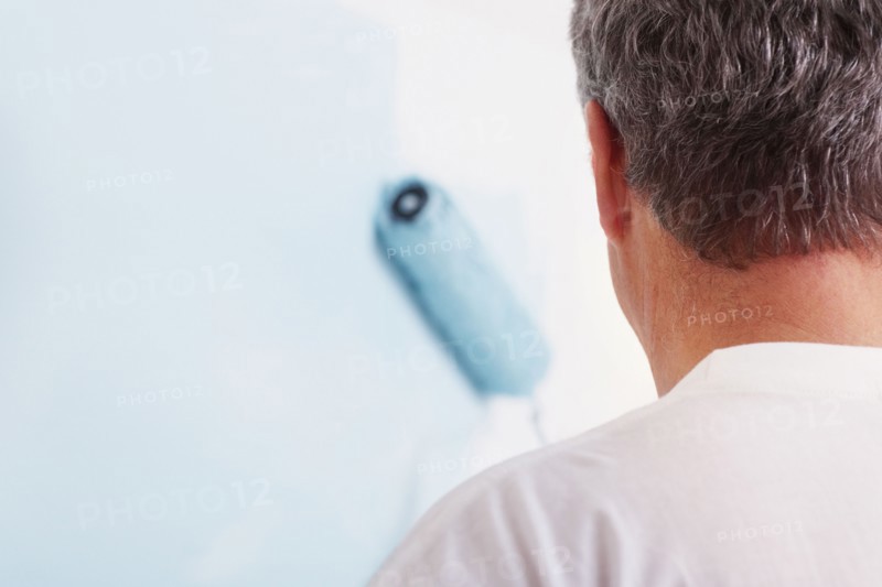 Man painting wall. Photographer: momentimages