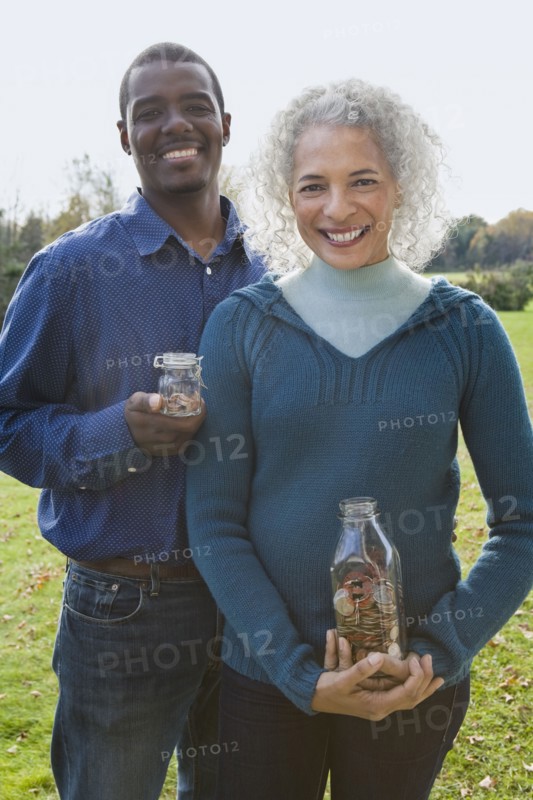 Couple holding jars. Photographer: Pauline St.Denis