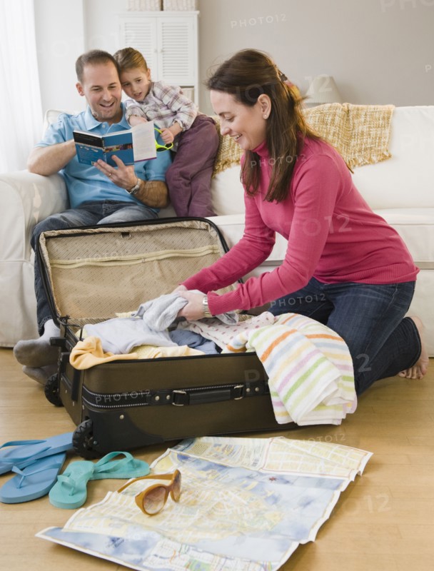Packing for family vacation. Photographer: Jamie Grill