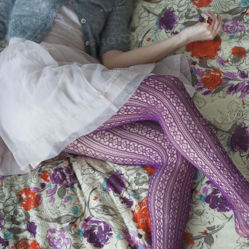 Purple tights on woman's legs.