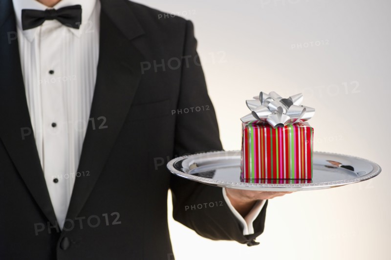 Butler holding gift.
