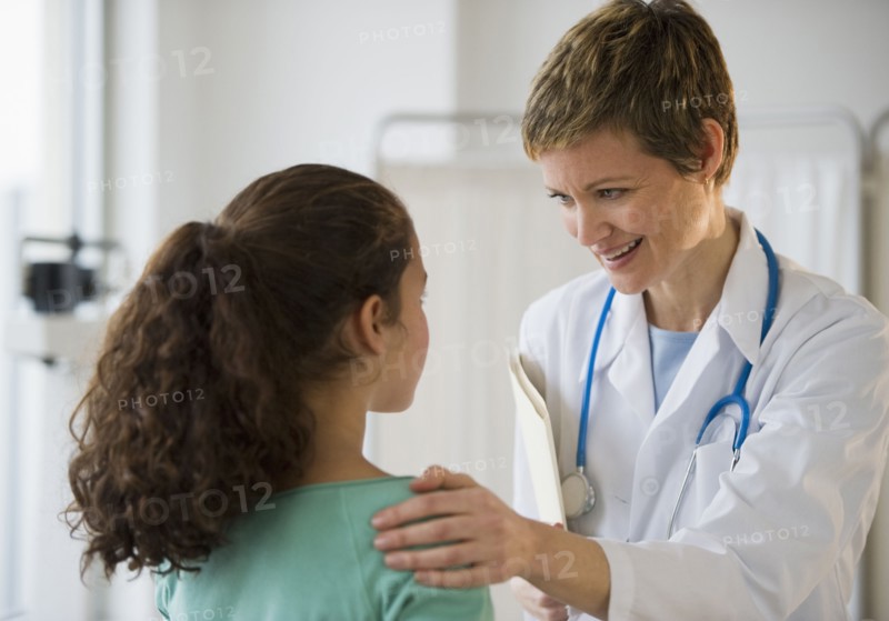 Doctor and patient in pediatrician's office.