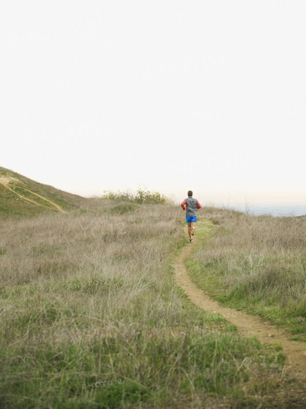Person running on trail.