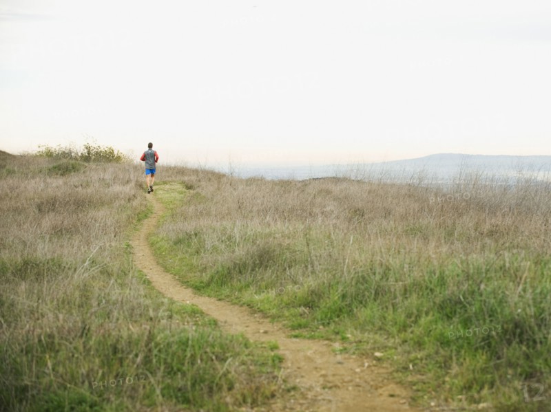 Person running on trail.