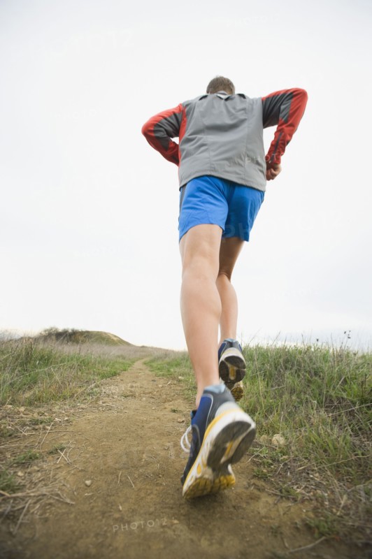 Person running on trail.