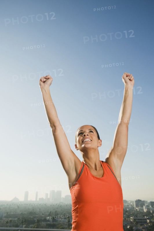 Woman raising her arms.