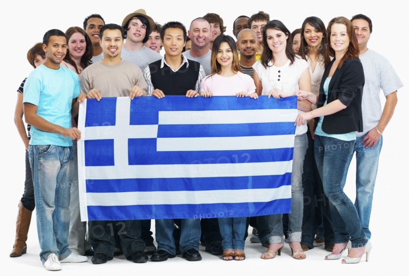 Group of people holding flag. Photographe : momentimages