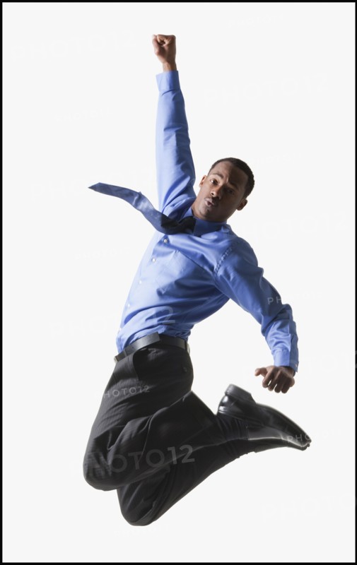 Businessman jumping. Photographe : Mike Kemp