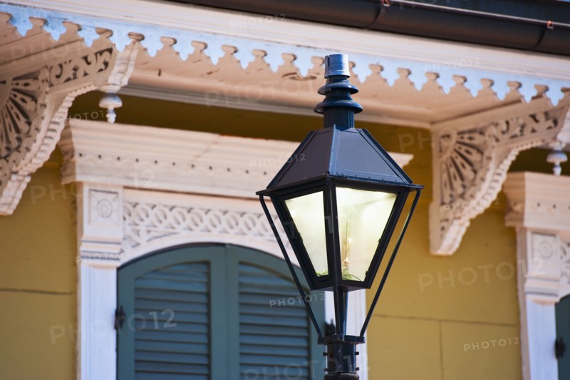 Lamp post in front of house in French Quarter of New Orleans.