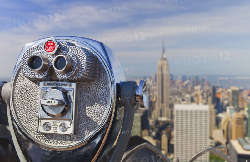 Coin operated binoculars looking out on New York City skyline.