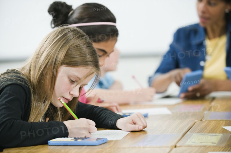 Students doing math work in classroom.