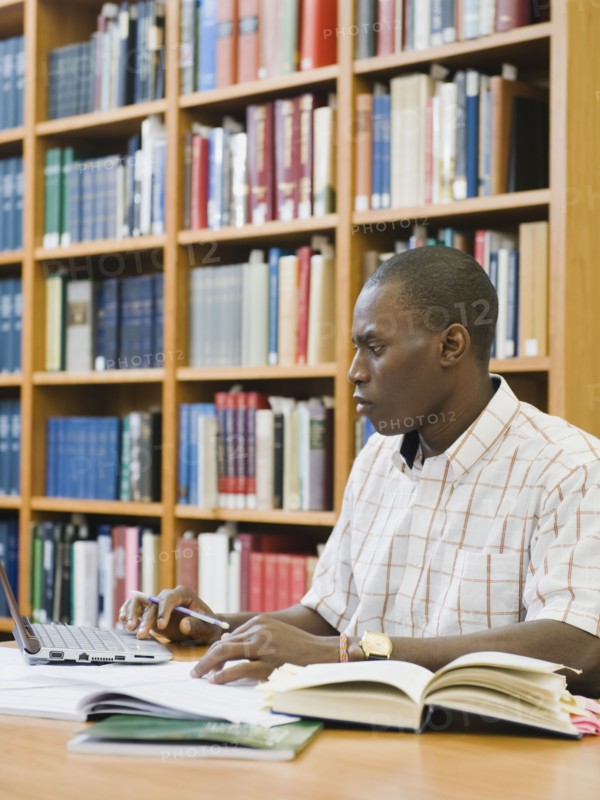 College student working in library.