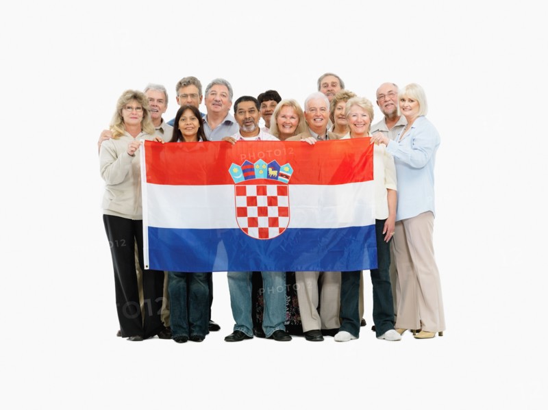 Group of people holding a Croatian flag. Photo : momentimages