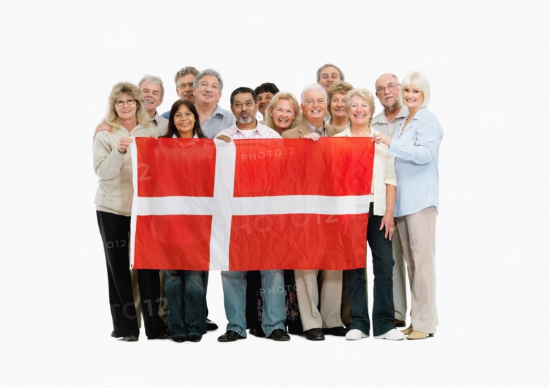 Group of people holding the flag of South Africa. Photo : momentimages