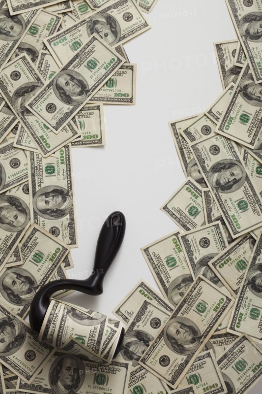 Lint roller picking up money. Photo : Mike Kemp
