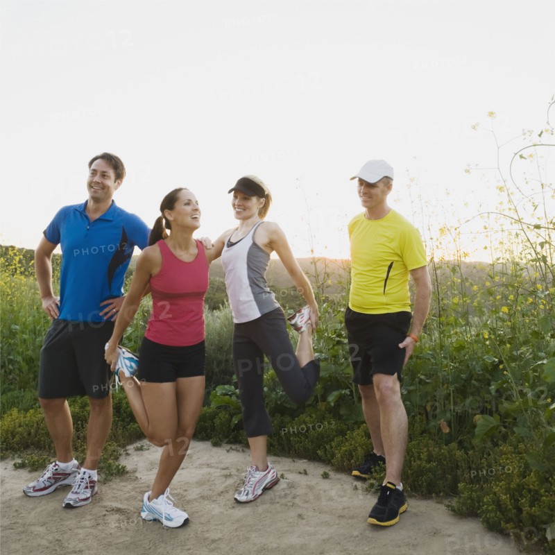 Trail runners stretching.