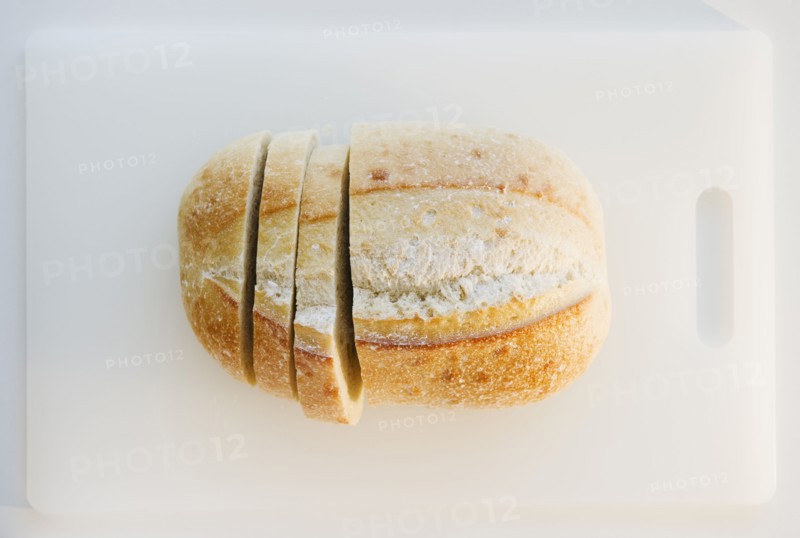 Freshly sliced bread on cutting board. Photo : Jamie Grill
