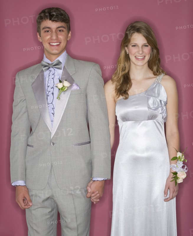 Couple dressed up for their prom.