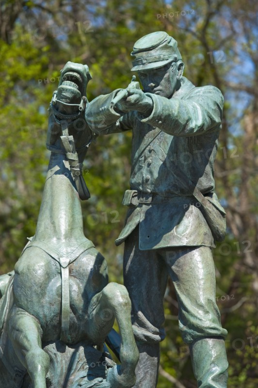 Statue of union solider and horse in military park.