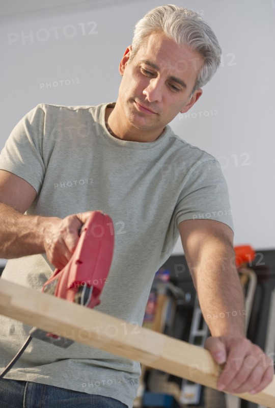 Handyman using an electric drill.