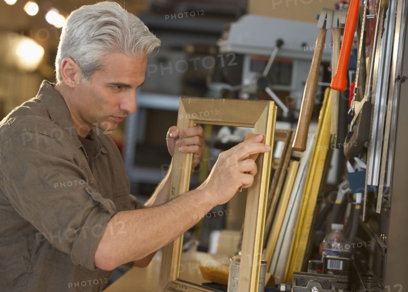 Craftsman making a picture frame.