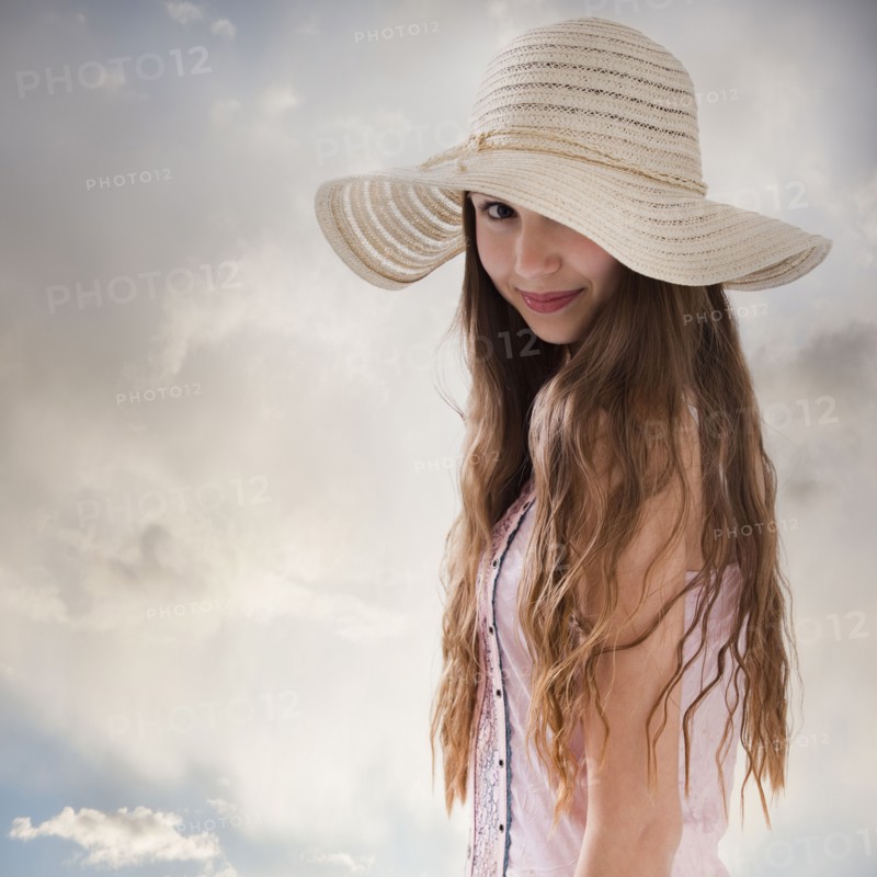 Beautiful long haired woman wearing a straw hat. Photo : Mike Kemp
